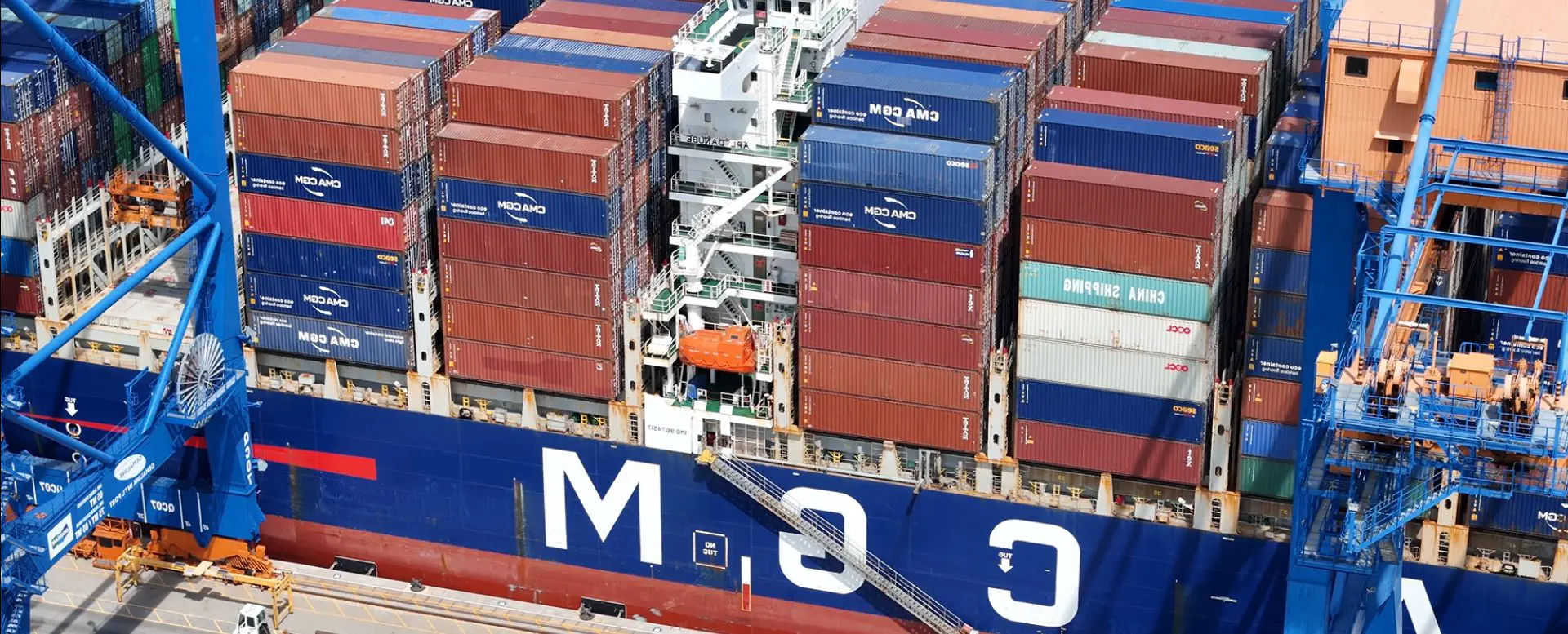 Cargo ship loaded with colorful shipping containers.